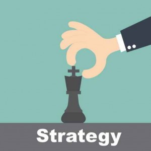 strategy concept - hand holding chess